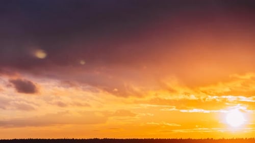 Clouds Passing Over the Horizon at Sunrise