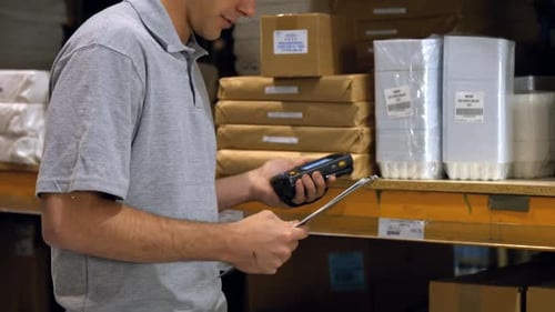 Worker scanning products with a barcode scanner