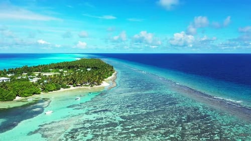 Wide angle birds eye copy space shot of a white sand paradise beach and aqua turquoise water