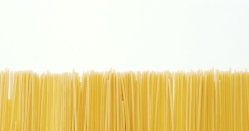 Close Up of Uncooked Spaghetti on White Background