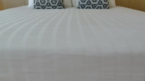 Comfortable Bed with Pillows in a Hotel Room