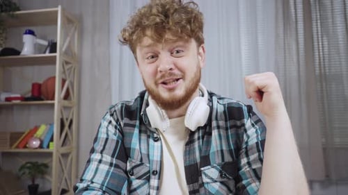 Young Adult Man Explaining Something on Camera