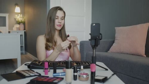 Young Woman Applying Lipstick for Beauty Vlog