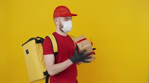 Delivery Man Holding Gift with Red Bow