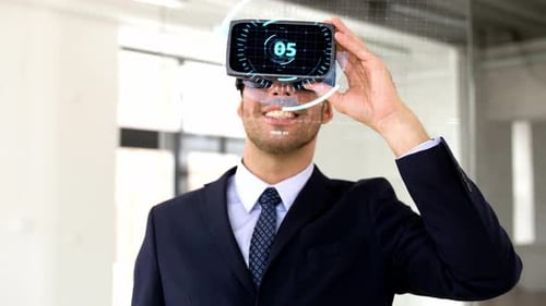 Businessman Uses Virtual Reality Headset in Office