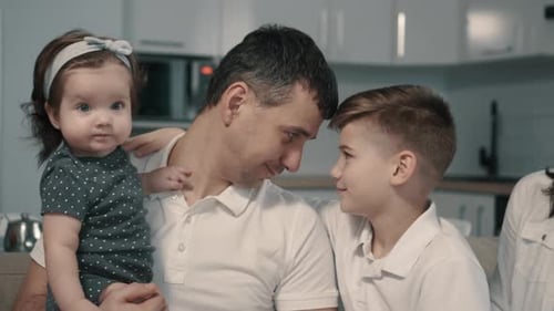 Loving Family Bonding Together in Their Home