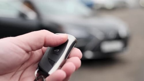 Close Up View of Locking and Unlocking Car with Key Remotely