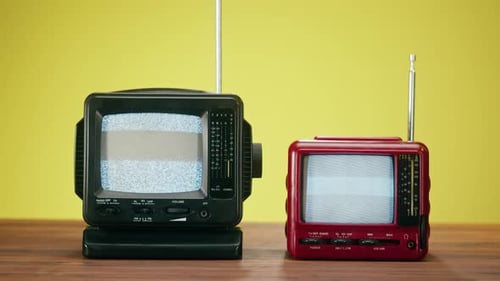 Vintage Televisions Displaying Static on Screens