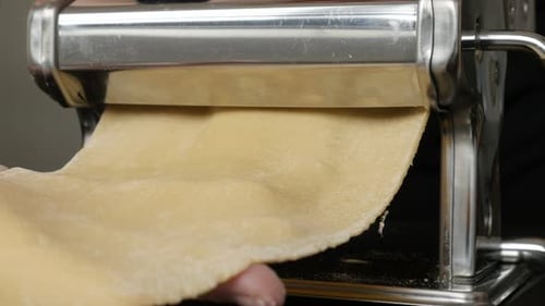 Pasta Dough Rolled Through Machine Close Up