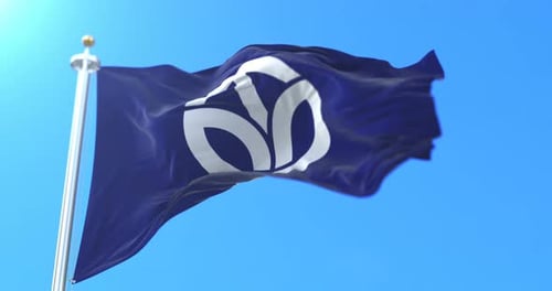 Waving Flag with Abstract Logo against Blue Sky