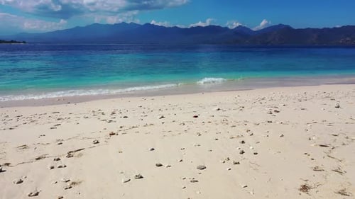 Aerial texture of exotic coast beach voyage by blue sea with bright sand background of adventure nea