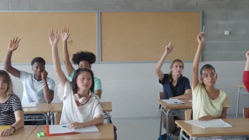 Students Raising Hands to Answer in Class