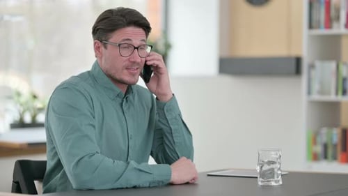 Man Talking on Smartphone During Phone Call