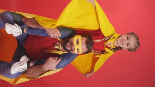 Happy Dad and Daughter Superhero Roleplay on Red
