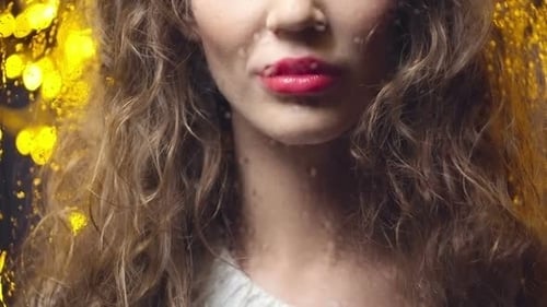 Young Beautiful Woman Looking out the Window