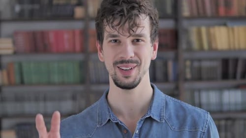 Smiling Man Doing Peace Sign