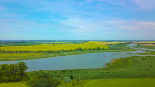 Aerial View of River and Green Fields
