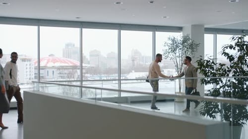 Adults Walking in a Modern Office Building