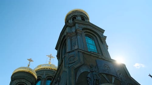 Kubinka Russia CIRCA 2021 Close Up Orthodox Church or Tample in Black Color with Golden Domes Sun