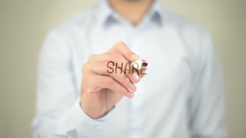 Man Writing Share on Transparent Surface