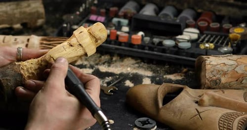 Close Up Male Hands Using Power Wood Working Tools Graver Carving