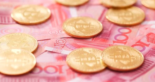 Golden Bitcoin Coins on Red Currency Notes