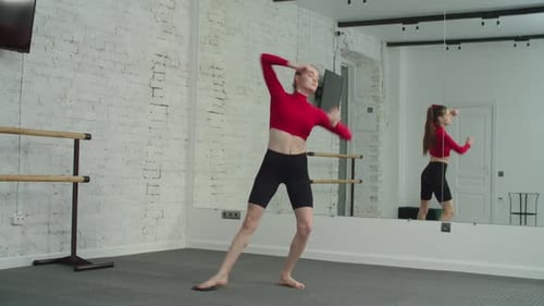 Woman Warming Up Stretching in Dance Studio
