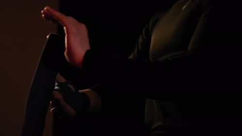 Mma Fighter Man Wrapping His Hands in Boxing Tape Before a Fight Close Up View Footage