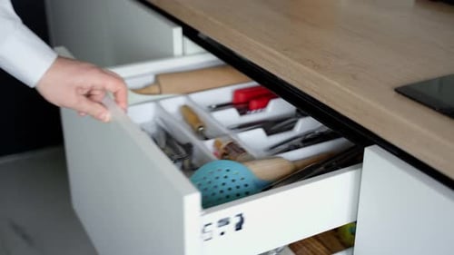 Opening Drawer With Modern Kitchen Utensils