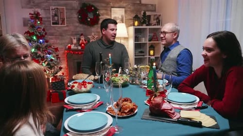 Family Gathered at Christmas Dinner Table