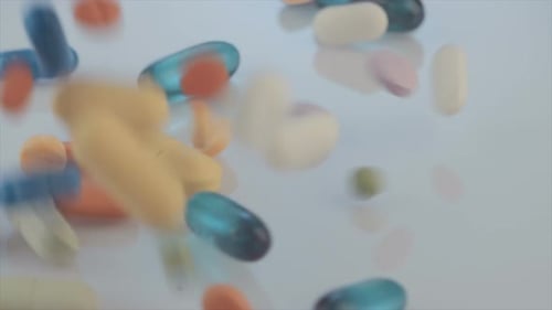 Colorful Pills and Capsules Falling