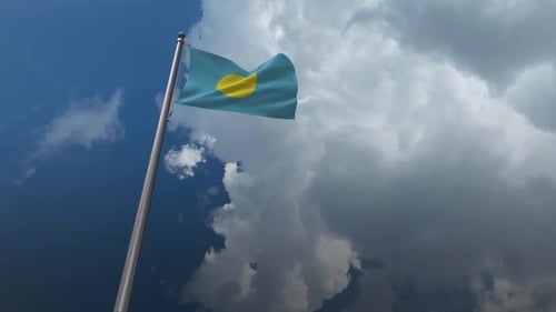 Palau National Flag Waving in Blue Sky with Clouds