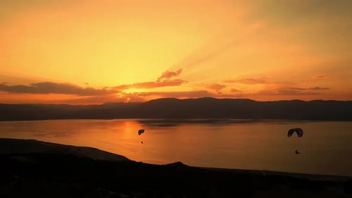 Paragliders With Sunset