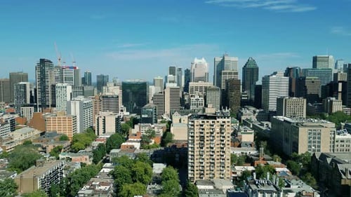 4K Cinematic urban drone footage of an aerial view of buildings and skyscrapers in the middle of dow