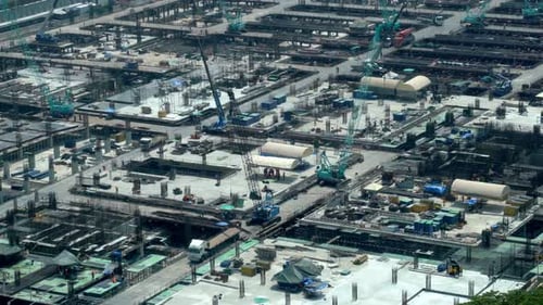 Large Construction Site with Heavy Construction Machinery in Metropolis