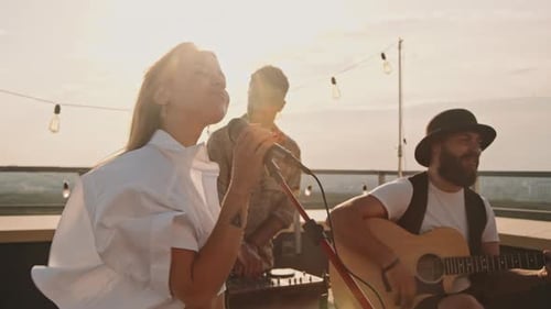 Musicians Playing at Party on Rooftop Terrace