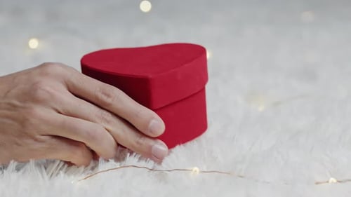 Red Heart Gift Box on White Plush Surface
