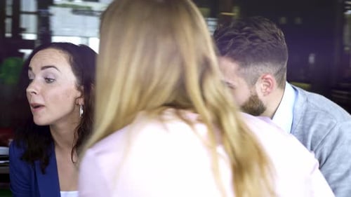 Diverse Team Collaborating on Project in Office