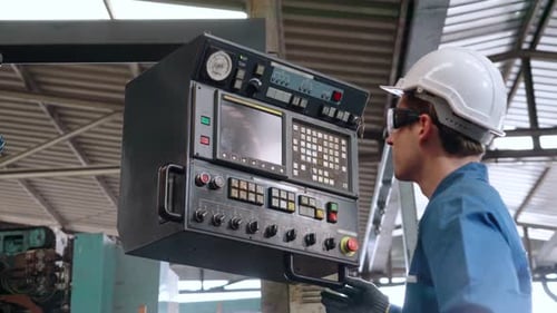 Smart Factory Worker Using Machine in Factory Workshop