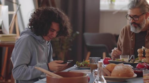 Family Meal Together Indoors at Dining Table