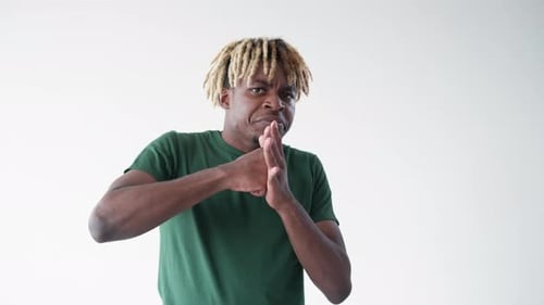 Young Adult Makes a Weird Hand Gesture