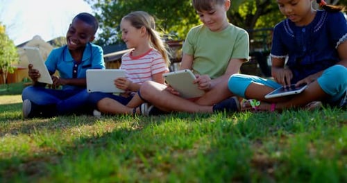 Kids using digital tablet in the playground 4k