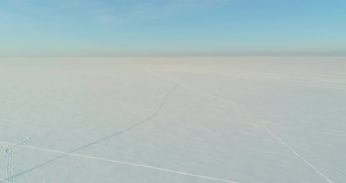 Aerial View of Cold Winter Landscape Arctic Field Trees Covered with Frost Snow Ice River and Sun
