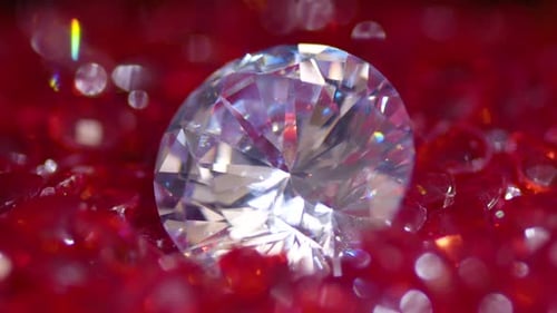 Macro Shot of Sparkling Gemstone on Red Surface