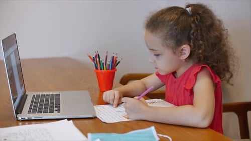 Distance Learning Online Education Schoolgirl Sits at Home at Her Desk Performs a School Assignment