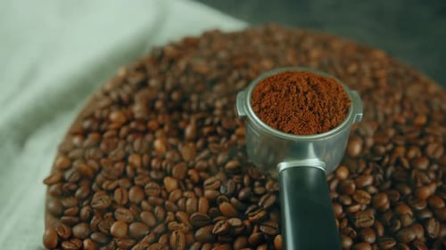 Roasted Coffee Beans with Portafilter and Coffee Grounds