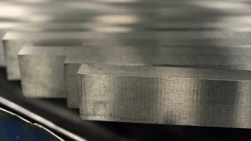 Straight Row of Metal Bars After Grinding