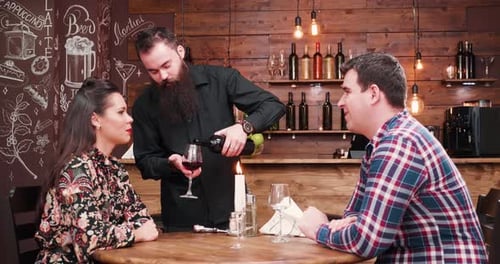 Waiter Pours Wine for Couple on Romantic Date