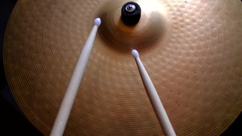 Drum Sticks Hitting Metal Bronze Cymbal Close Up