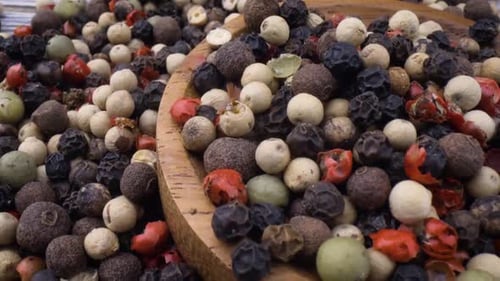 Colorful Peppercorns Macro Shot in Wooden Bowl